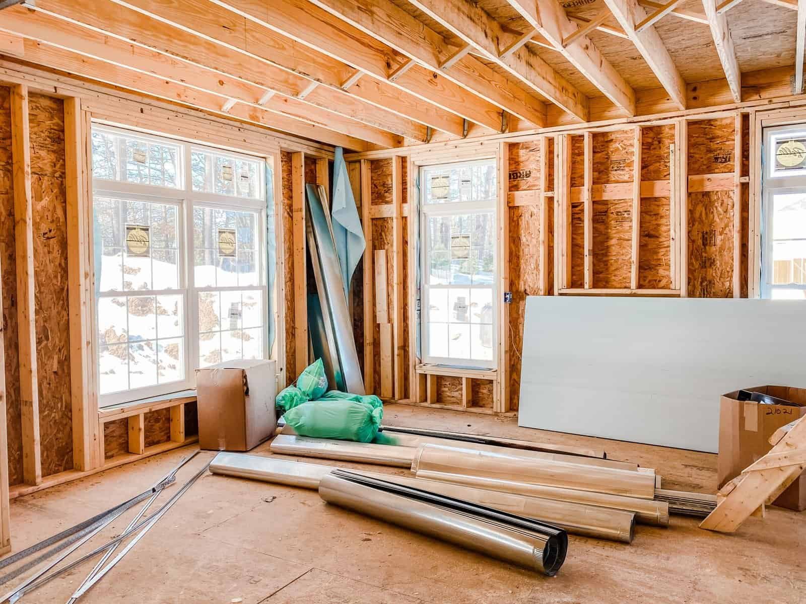 High-quality interior framing of a new home under construction with wooden studs and insulation materials.